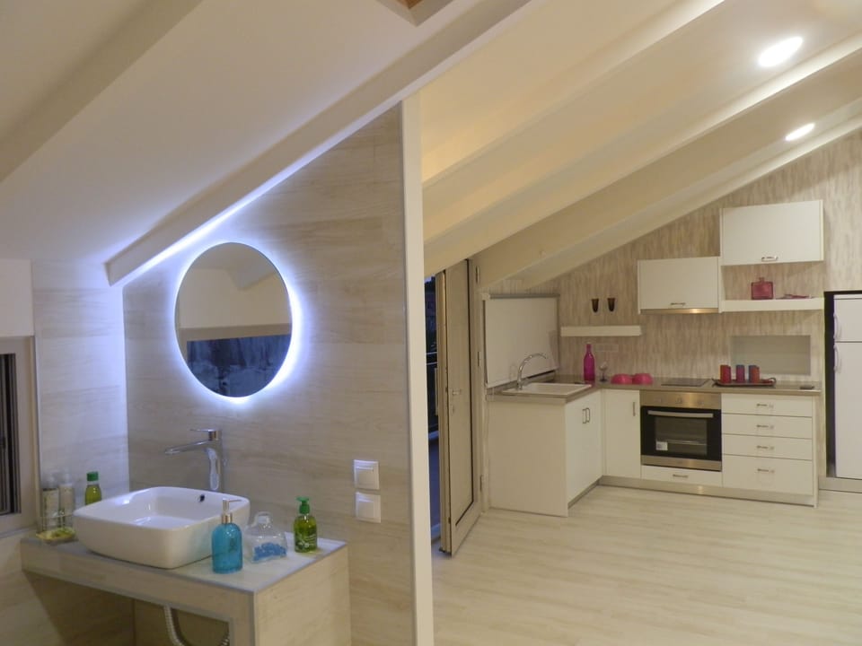 Luxury Loft, Partial Sea View | Private kitchen | Full-size fridge, stovetop, coffee/tea maker, electric kettle