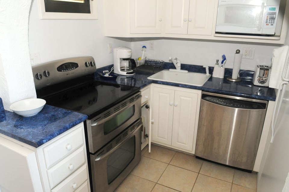 Fridge, microwave, oven, cookware/dishes/utensils