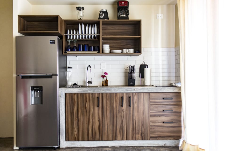 Full-size fridge, coffee/tea maker, cookware/dishes/utensils