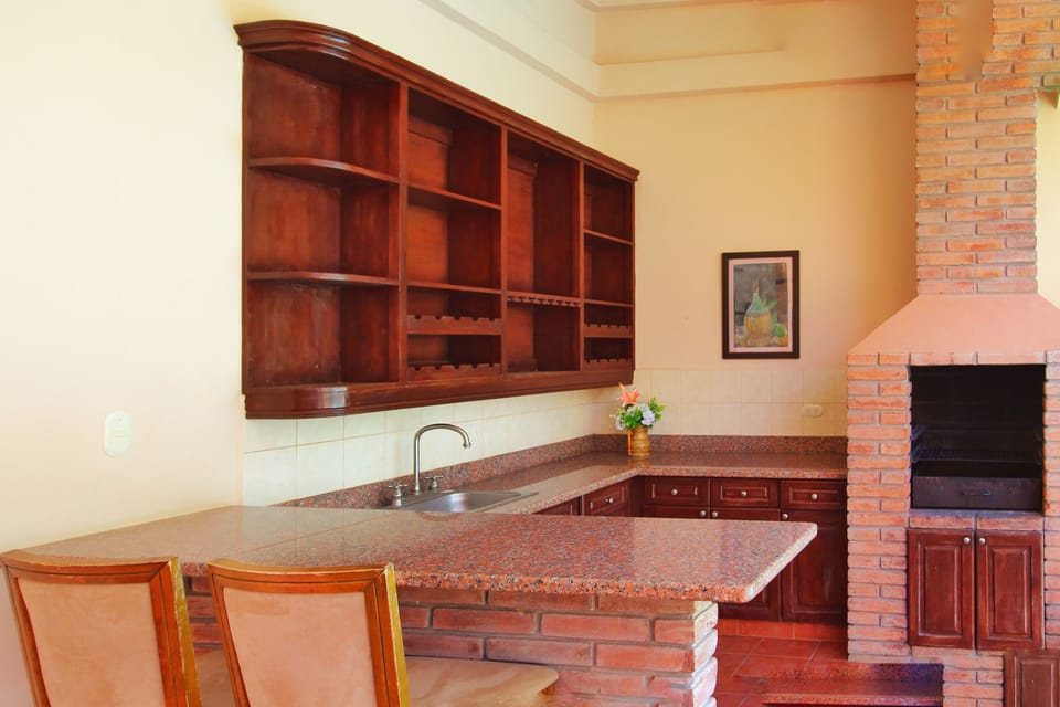 Deluxe House, Multiple Bedrooms, Non Smoking, Pool View | Private kitchen | Coffee/tea maker, fridge, microwave, stovetop