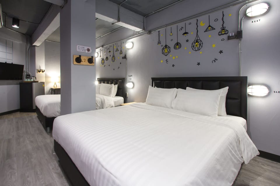 Family Quad Room No Window | Individually furnished, blackout drapes, soundproofing, free WiFi