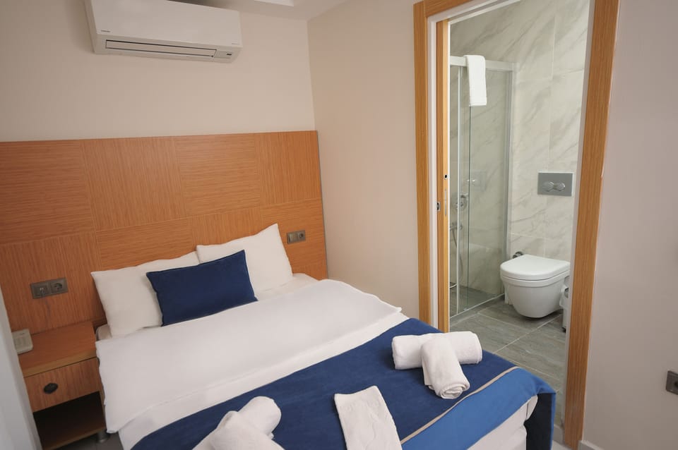 Economy Room, 1 Double Bed, Ground Floor | Minibar, in-room safe, soundproofing, free WiFi