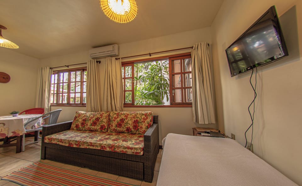 Standard Apartment | Living area | 26-inch LED TV with satellite channels, TV