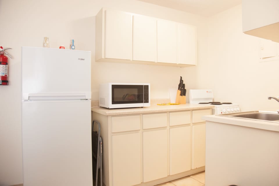 Apartment, 2 Bedrooms | Private kitchen | Coffee/tea maker, full-size fridge, microwave, oven