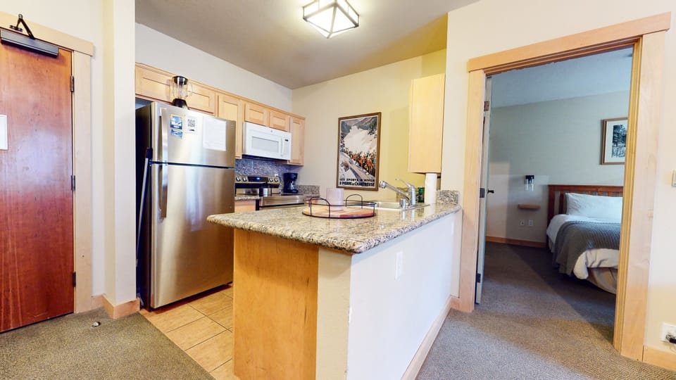 Condo, 2 Bedrooms | Private kitchen | Full-size fridge, microwave, oven, stovetop