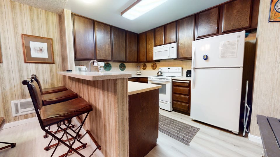 Condo, 2 Bedrooms | Private kitchen | Full-size fridge, microwave, oven, stovetop
