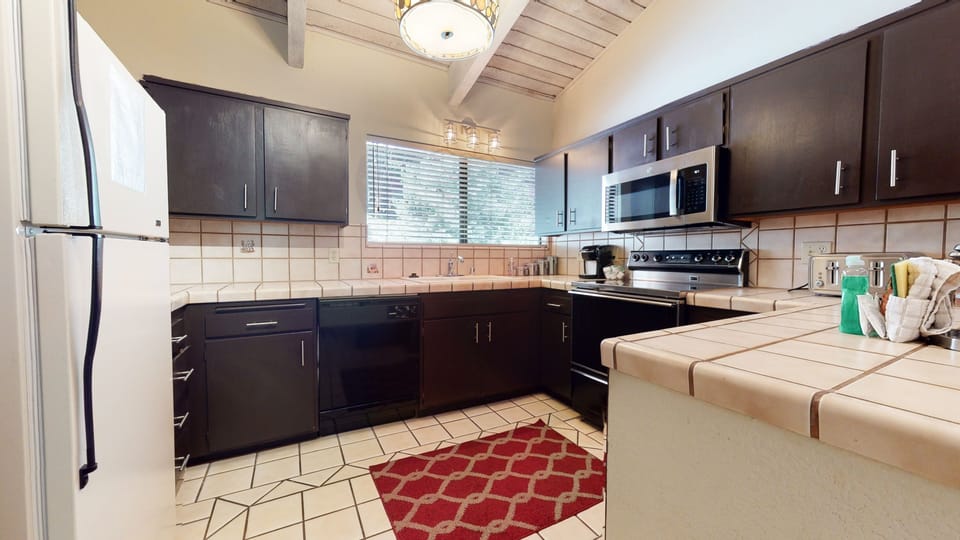 Condo, 2 Bedrooms | Private kitchen | Coffee/tea maker, full-size fridge, microwave, oven