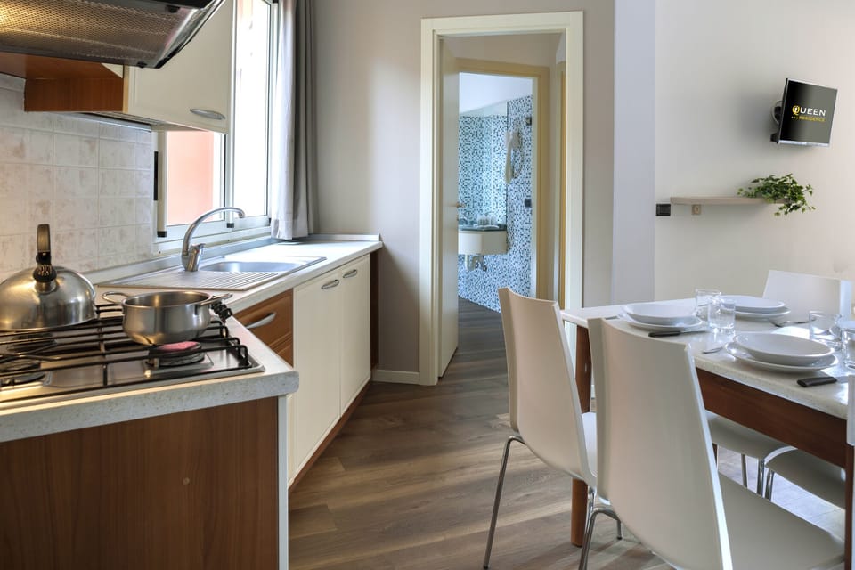 Apartment, 1 Bedroom, Balcony | Private kitchen | Full-size fridge, microwave, stovetop, cookware/dishes/utensils