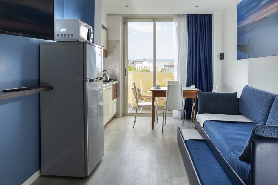 Apartment, 1 Bedroom, Balcony | Living area | Flat-screen TV