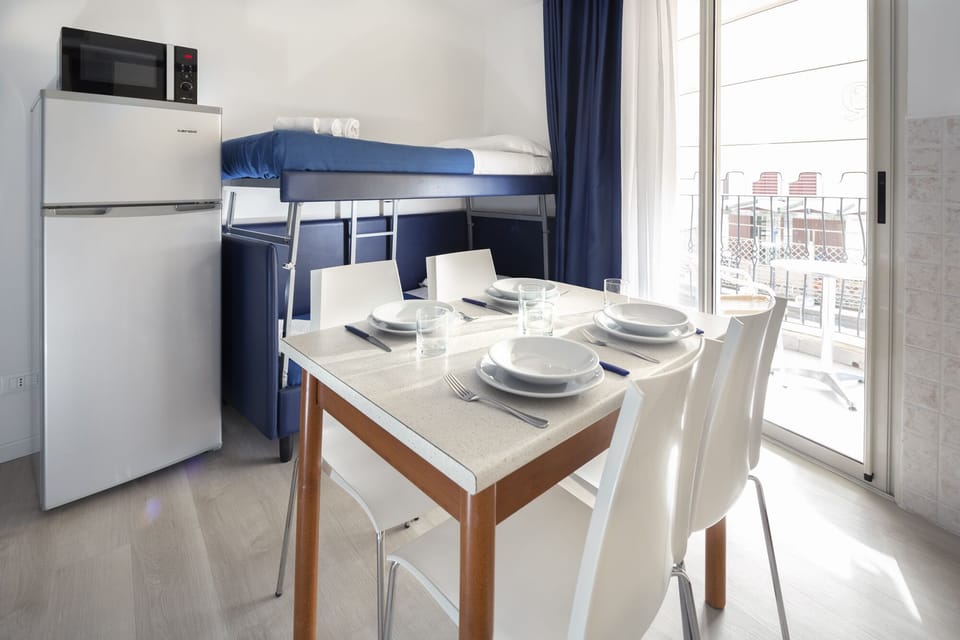 Apartment, 2 Bedrooms, Balcony | Living room | Flat-screen TV