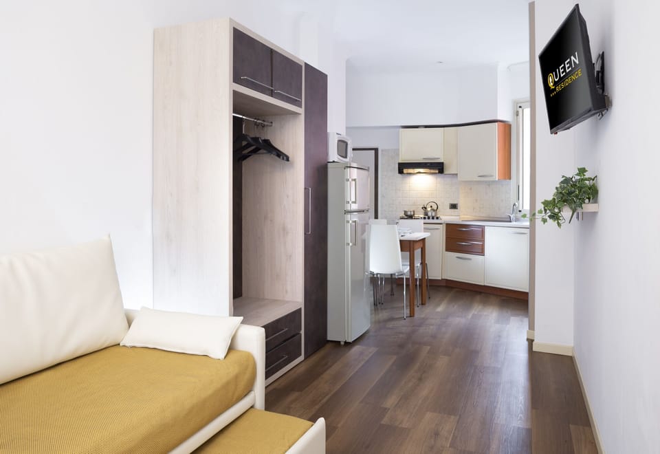 Apartment, 1 Bedroom, Balcony | Living room | Flat-screen TV