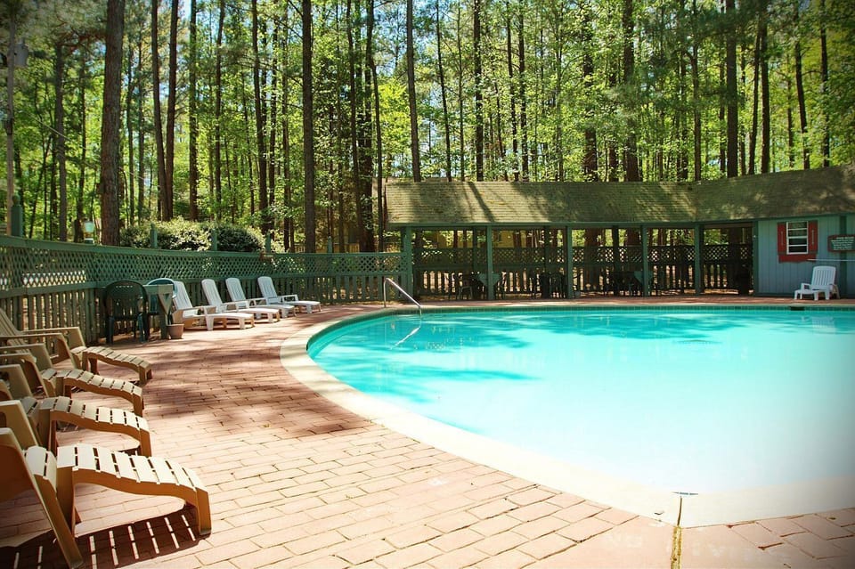 Seasonal outdoor pool, open 9 AM to 10:00 PM, pool umbrellas