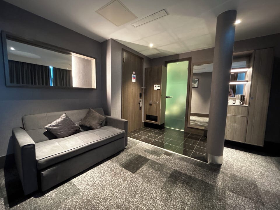 Suite, 1 King Bed, Balcony | Living area | Flat-screen TV