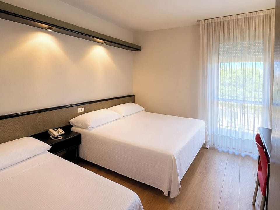Standard Triple Room | Hypo-allergenic bedding available, in-room safe, desk, laptop workspace