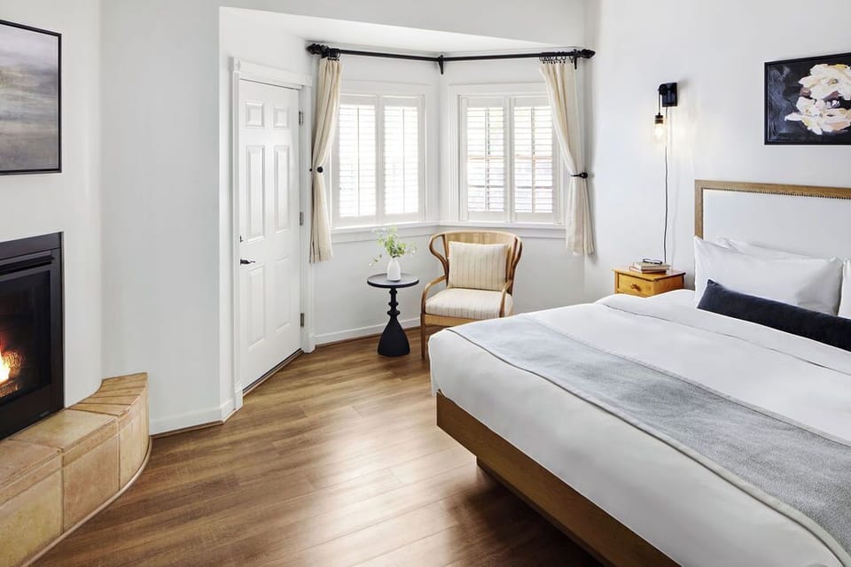 Carriage House King + Fireplace | Premium bedding, down comforters, iron/ironing board, free WiFi
