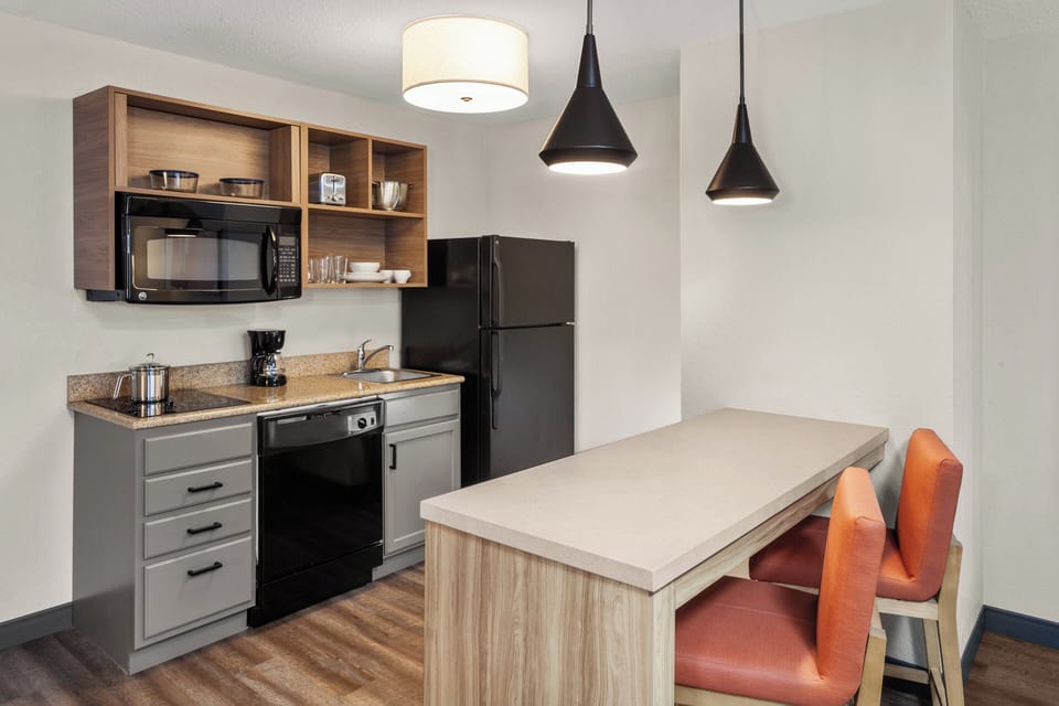 Suite, 1 Bedroom | Desk, laptop workspace, blackout drapes, iron/ironing board