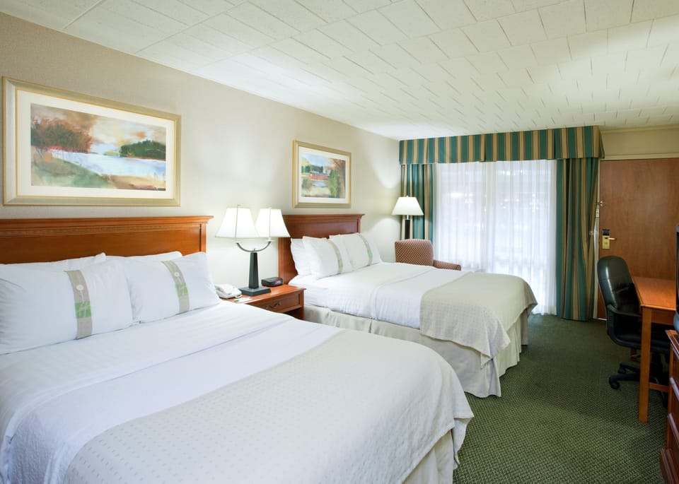 Desk, laptop workspace, blackout drapes, iron/ironing board