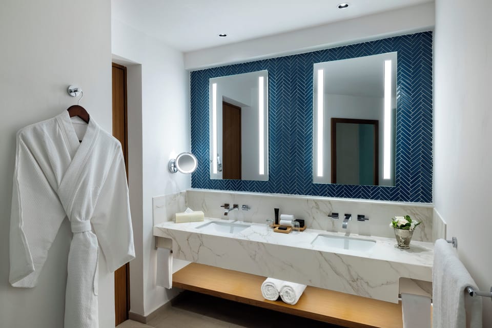 Separate tub and shower, designer toiletries, hair dryer, bathrobes