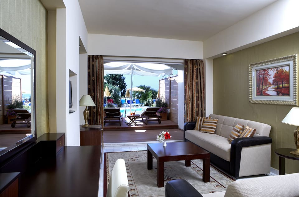 Junior Suite, Poolside | Living area | TV, foosball, table tennis