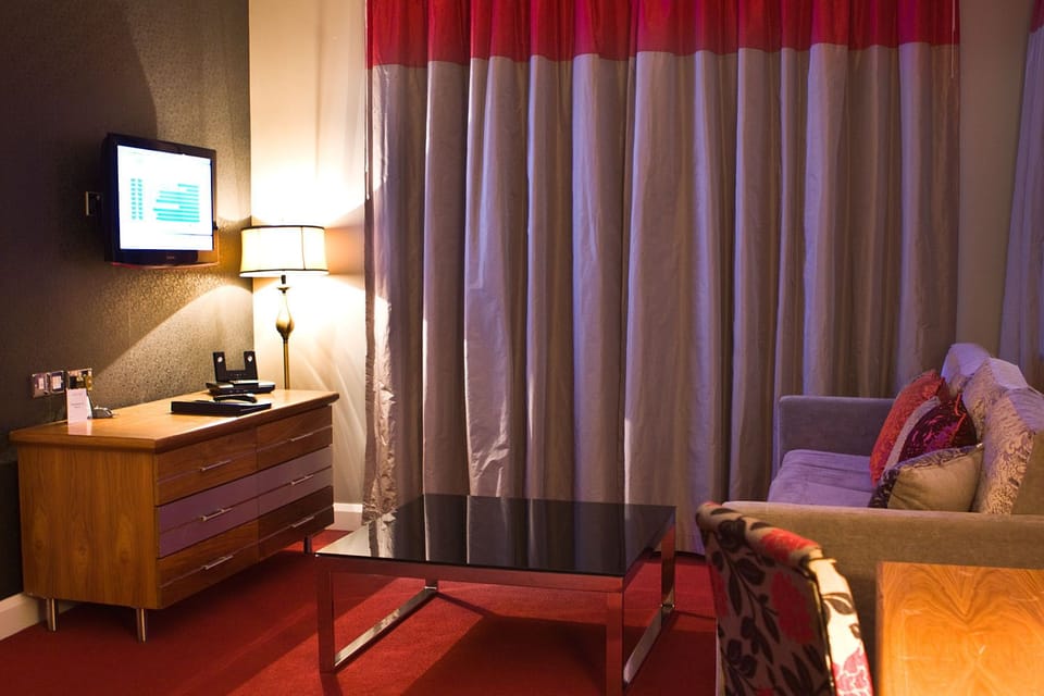 Junior Suite | Living room | Flat-screen TV