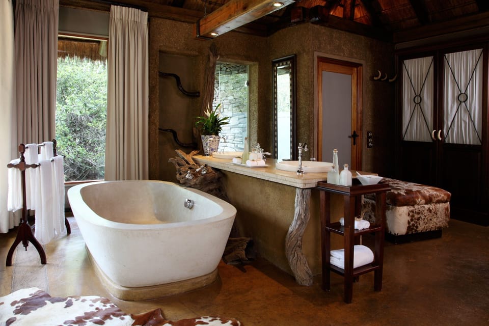 Separate tub and shower, deep soaking tub, designer toiletries