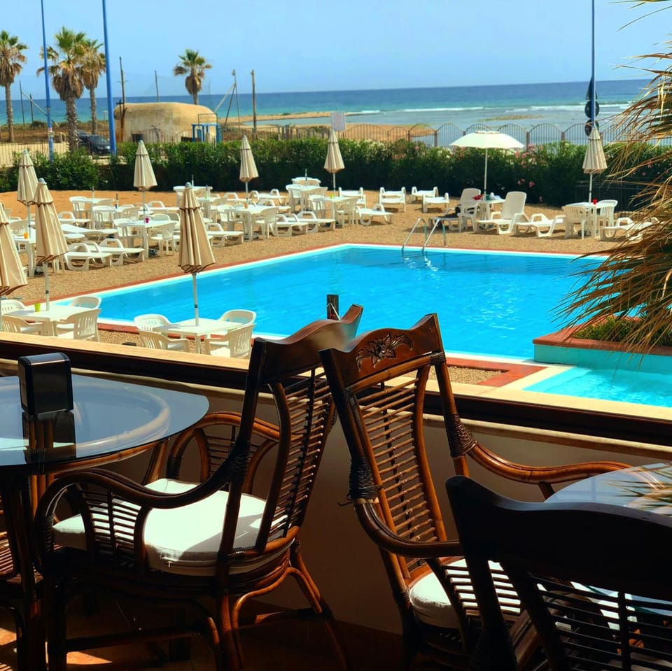 Outdoor pool, pool umbrellas, sun loungers