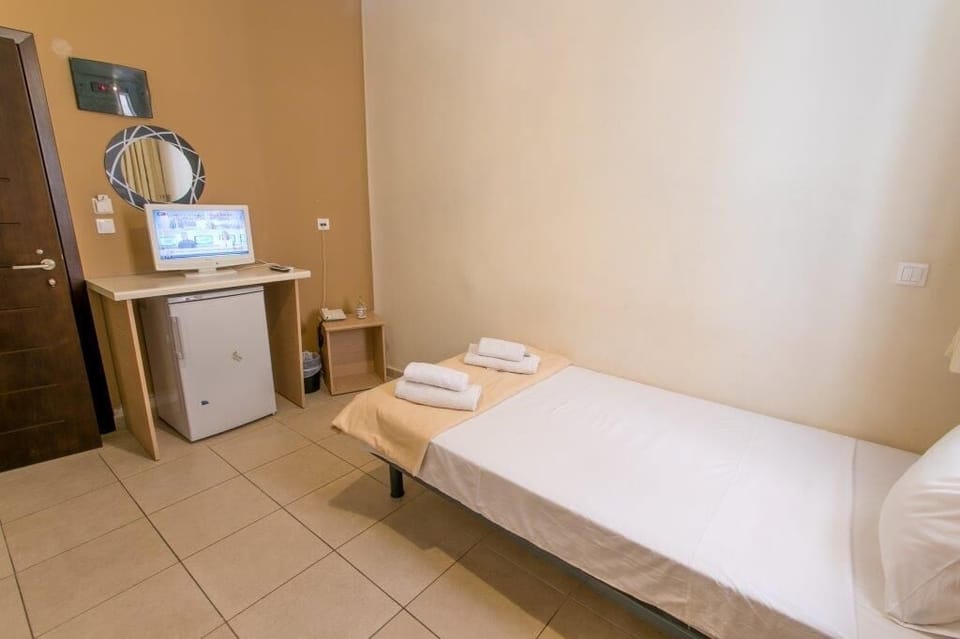Economy Single Room, 1 Twin Bed | In-room safe, iron/ironing board, free WiFi, bed sheets
