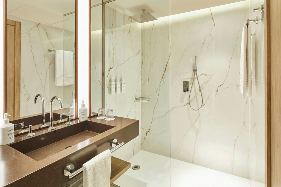 Suite, 1 Bedroom, City View | Bathroom | Free toiletries, hair dryer, slippers, towels