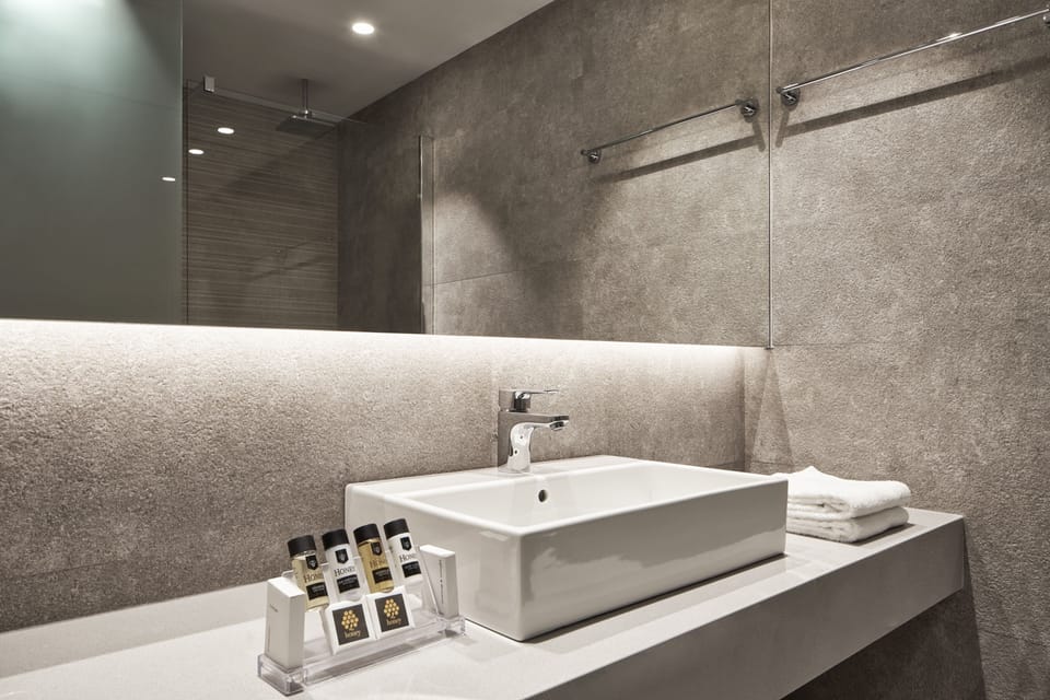 Family Room, Garden View | Bathroom | Shower, hair dryer, towels
