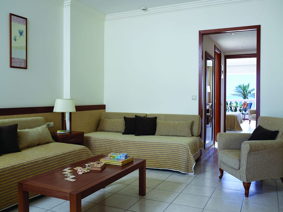 Junior Suite, Garden View | In-room safe, desk, free WiFi, bed sheets