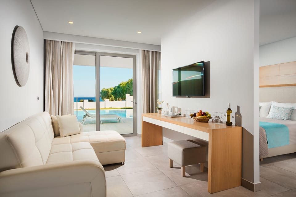 Junior Suite, Private Pool | In-room safe, desk, free WiFi, bed sheets