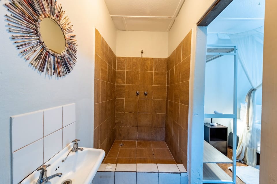 Masasa Rooms | Bathroom | Shower, rainfall showerhead, towels