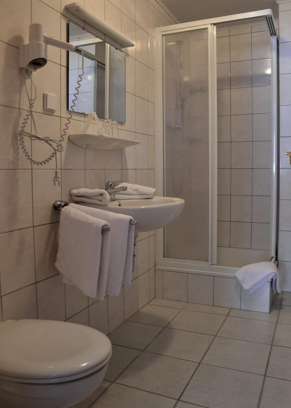 Shower, free toiletries, hair dryer, towels