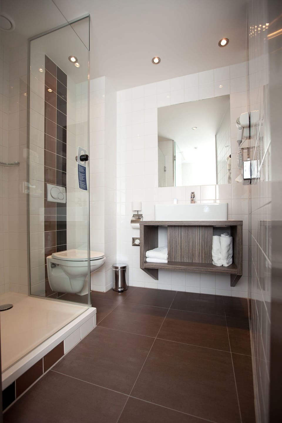 Shower, rainfall showerhead, hair dryer, towels