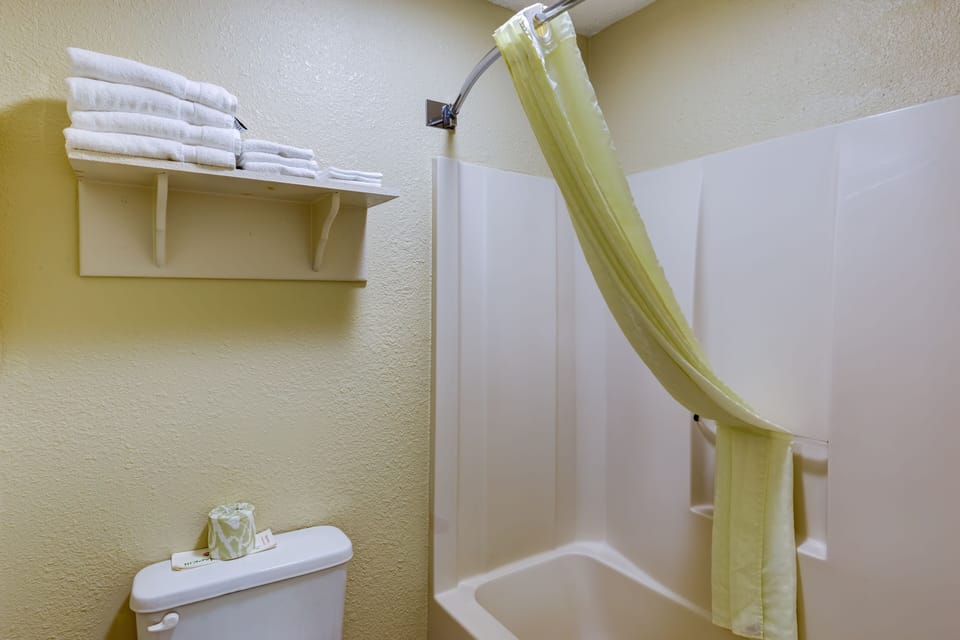 Room, 2 Double Beds | Bathroom | Rainfall showerhead, hair dryer, toilet paper