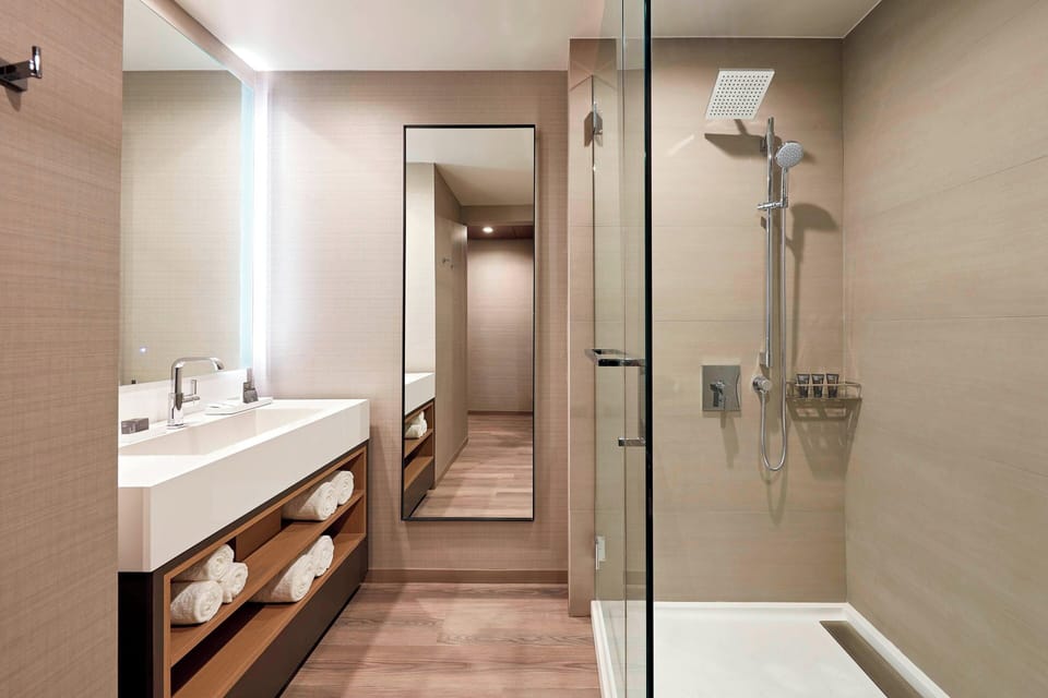 Combined shower/tub, designer toiletries, hair dryer, bathrobes