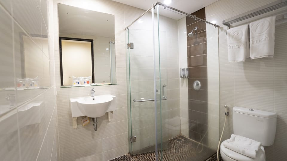 Shower, free toiletries, slippers, towels