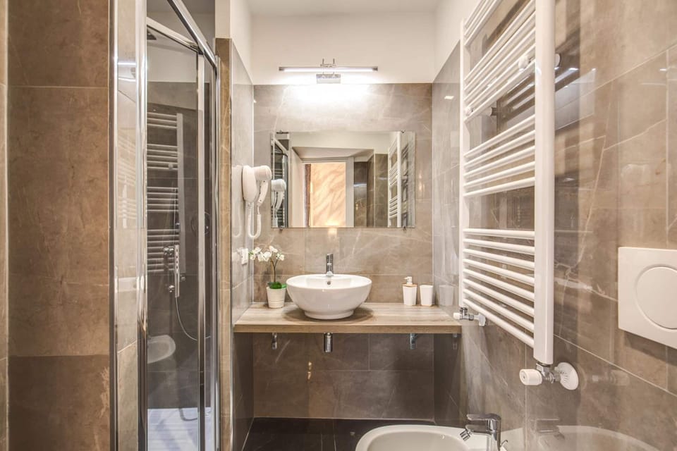 Shower, free toiletries, hair dryer, slippers
