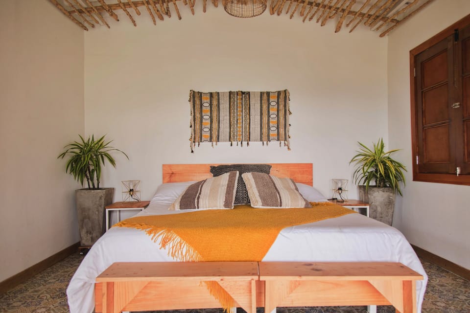 Bungalow, Garden View | Desk, bed sheets