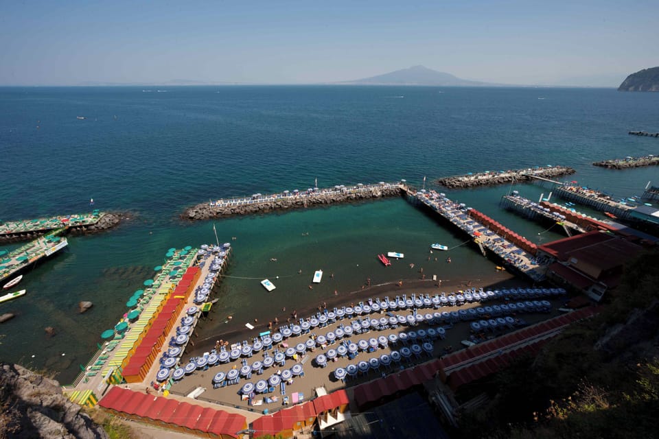 Beach nearby, black sand, sun loungers