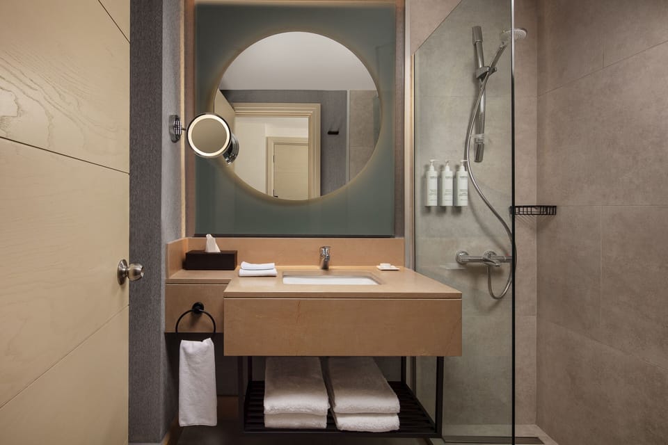 Shower, free toiletries, hair dryer, slippers
