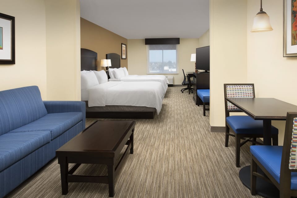 Desk, blackout drapes, iron/ironing board, rollaway beds