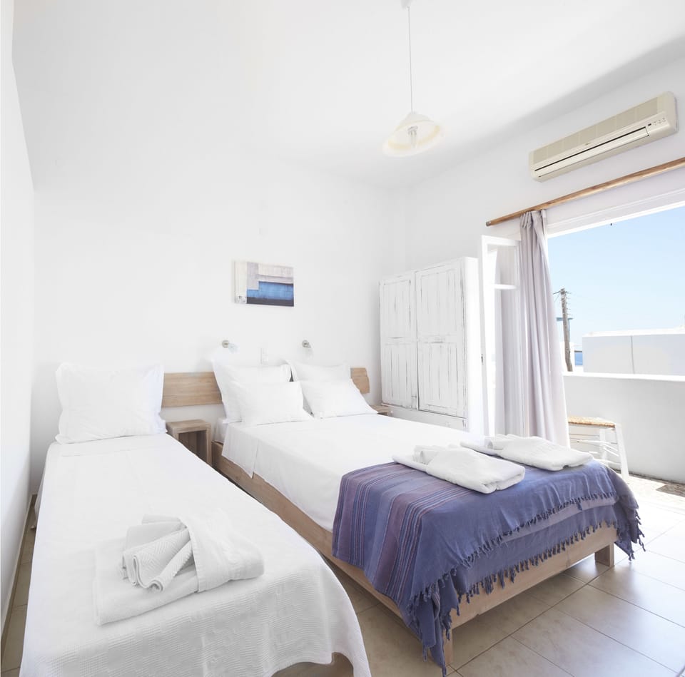 Triple Room | Minibar, desk, iron/ironing board, free WiFi
