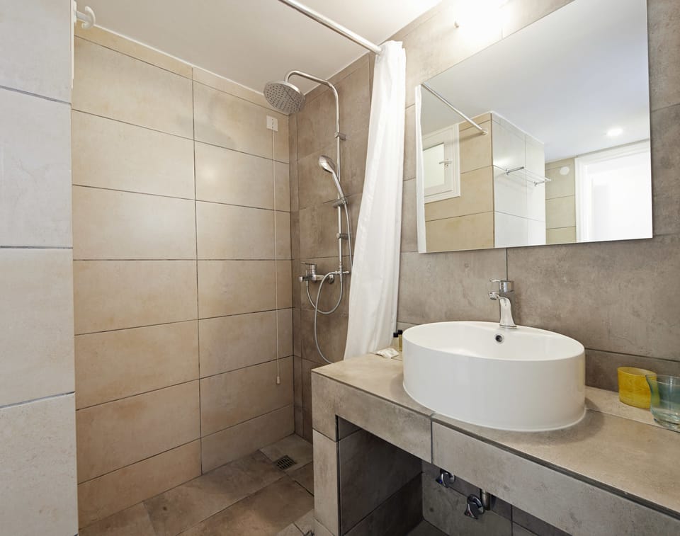 Family Suite, 2 Bedrooms (Side View) | Bathroom | Shower, free toiletries, hair dryer, towels