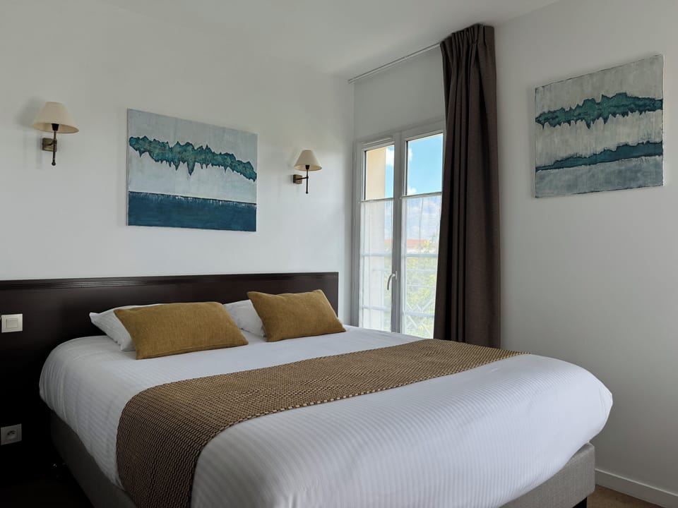 Comfort Room | Desk, laptop workspace, blackout drapes, soundproofing