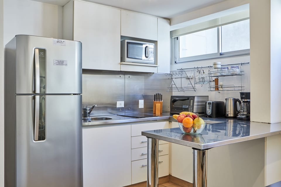 Apartment, 2 Bedrooms | Private kitchen | Fridge, microwave, stovetop, coffee/tea maker