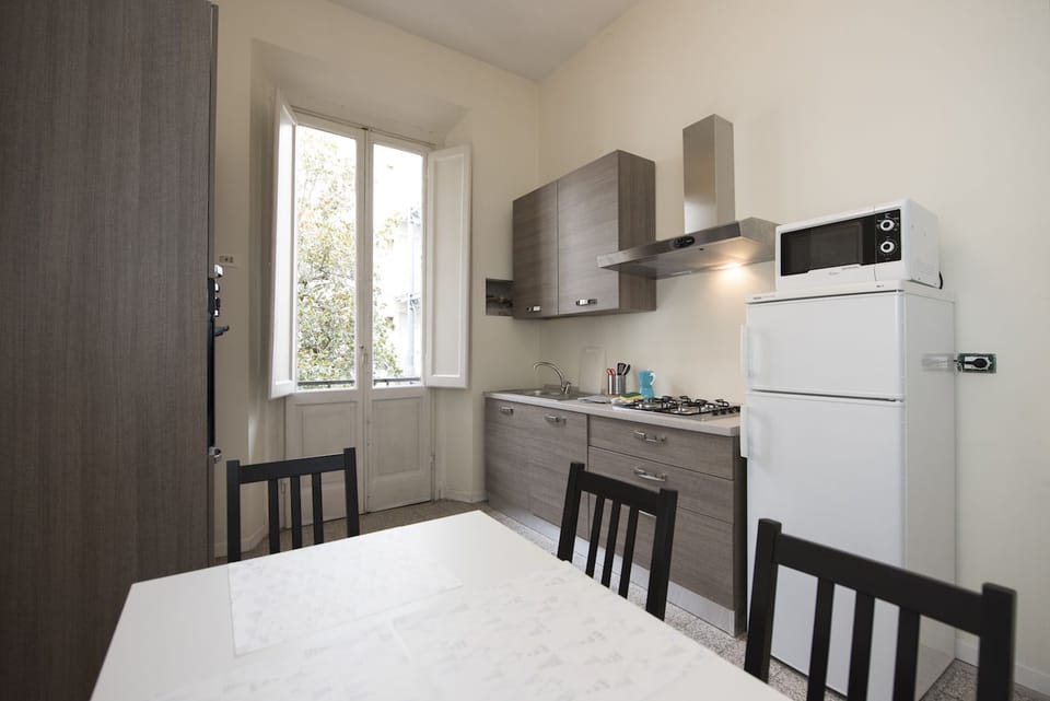 Basic Apartment, 4 Bedrooms | Private kitchen | Fridge, microwave, coffee/tea maker, cookware/dishes/utensils
