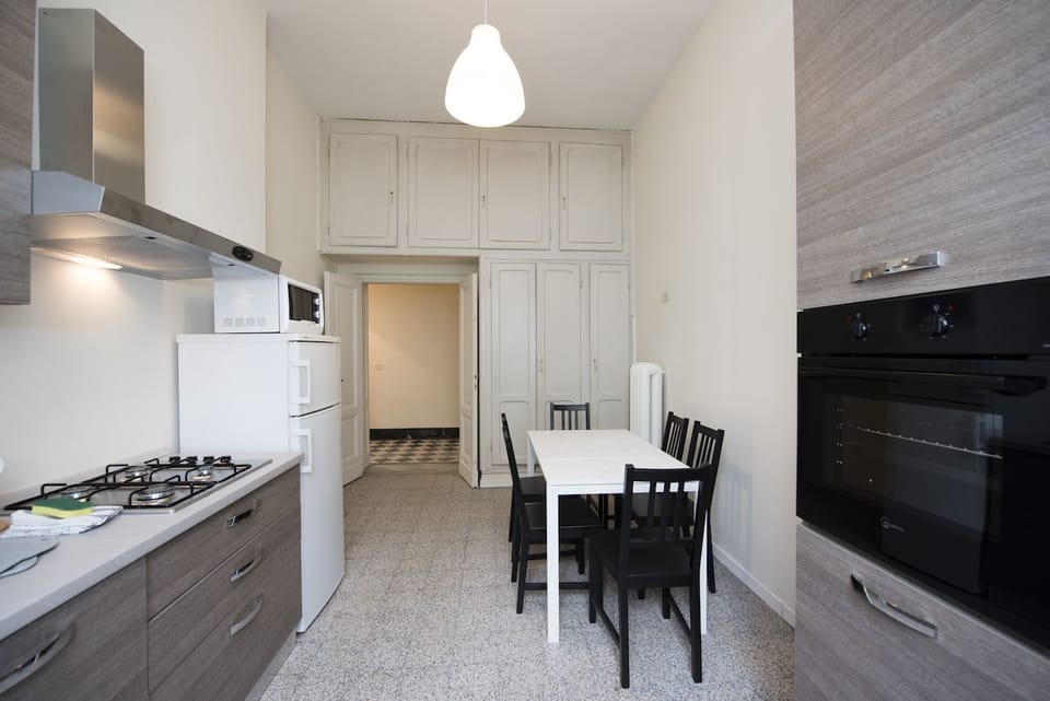 Basic Apartment, 4 Bedrooms | Private kitchen | Fridge, microwave, coffee/tea maker, cookware/dishes/utensils