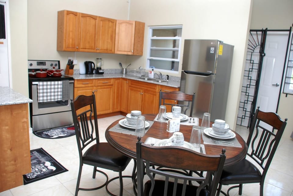 Townhome | Private kitchen | Coffee/tea maker, full-size fridge, microwave, oven