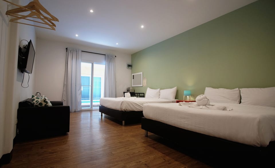 Triple Room with Balcony | In-room safe, blackout drapes, free WiFi, bed sheets